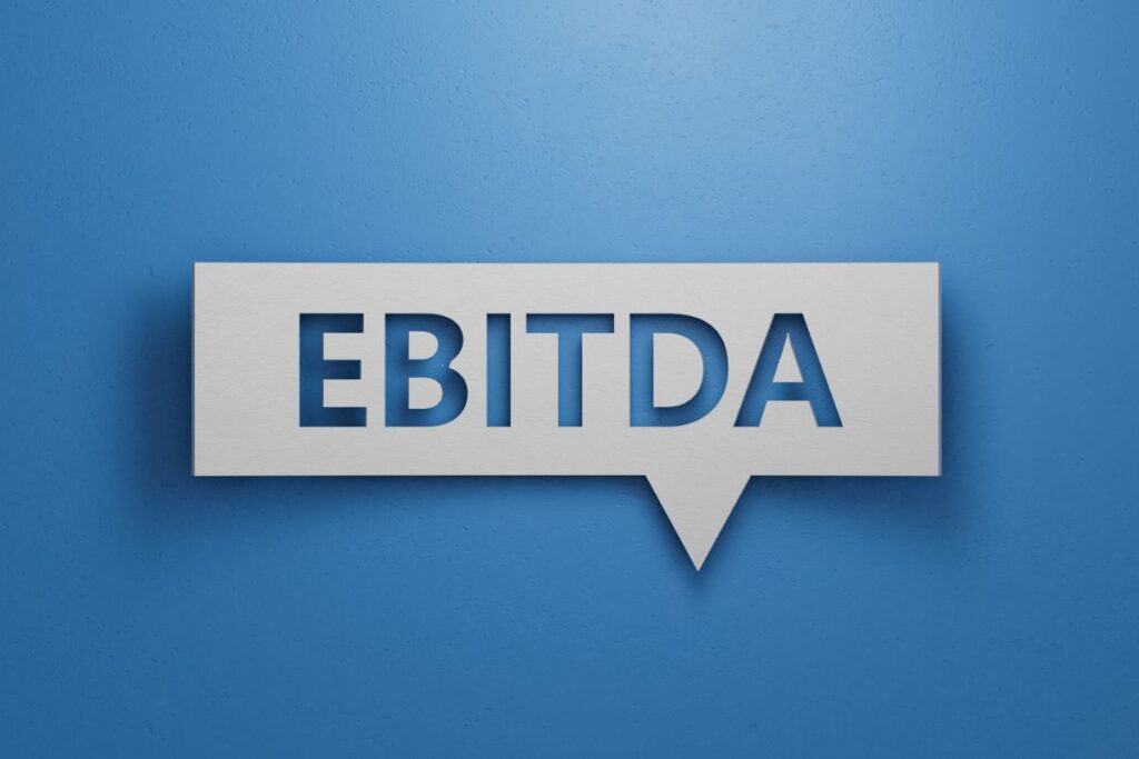 EBITDA acronym displayed in a speech bubble against a blue background