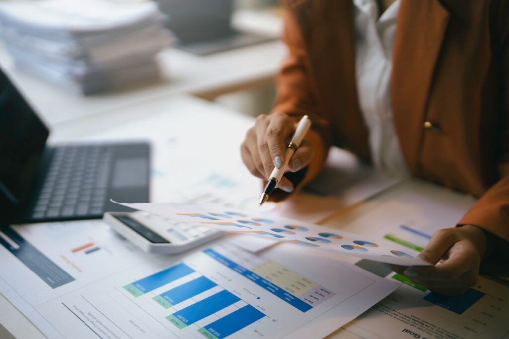 Business valuation report with financial documents and a computer keyboard on a desk