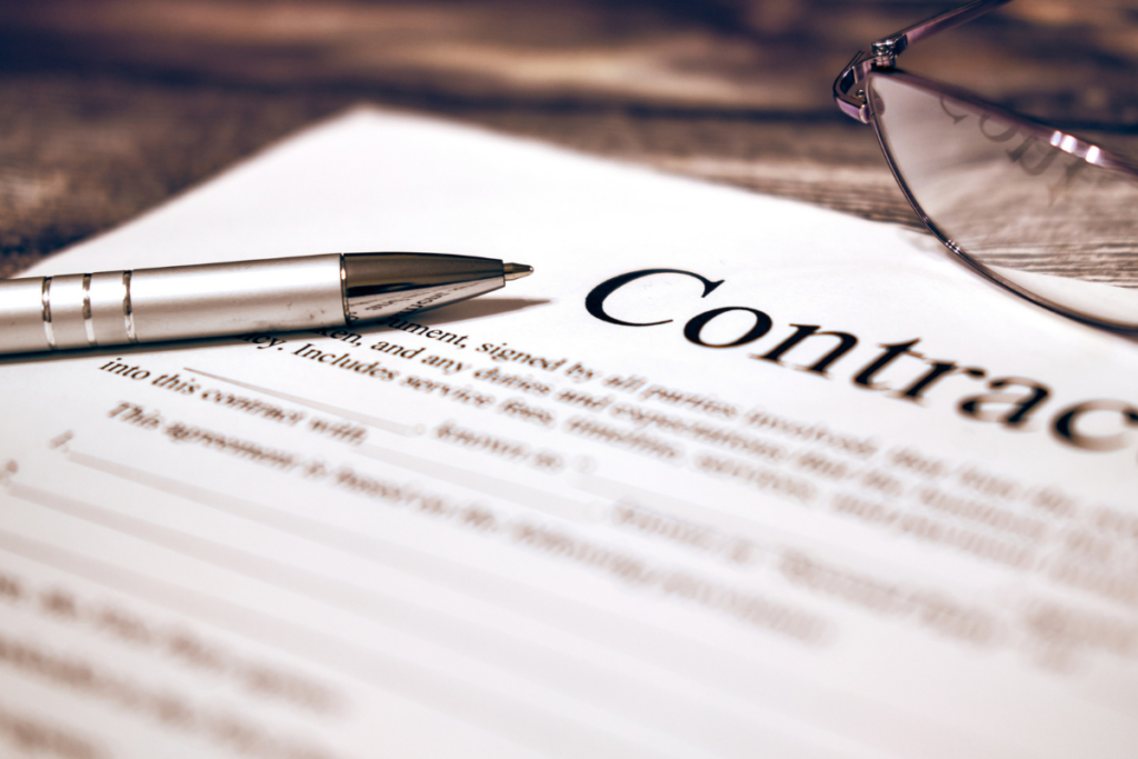 Business contract agreement being reviewed and signed