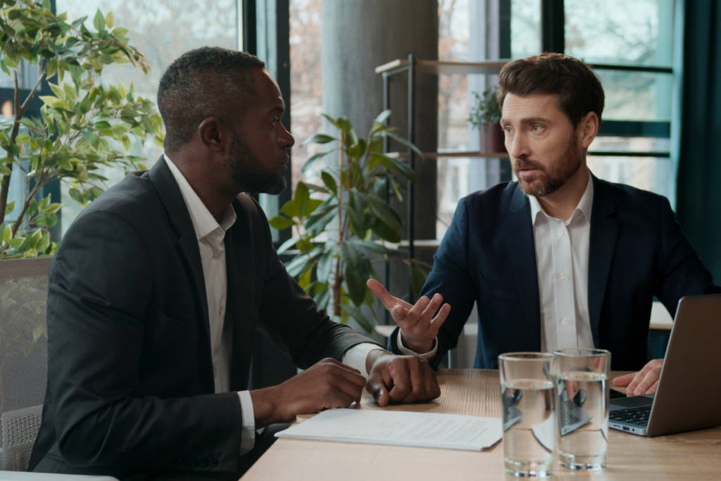 Business professionals discussing a financial deal and transaction